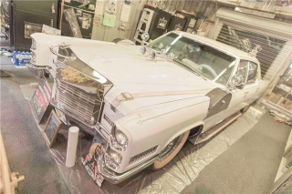 Dual air-horns on the hood of a ‘66 Cadillac Fleetwood........